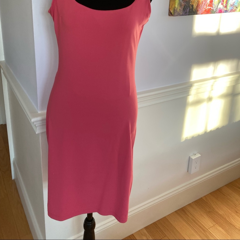Coral/salmon colored nylon/Lycra stretched and fitted low back dress.